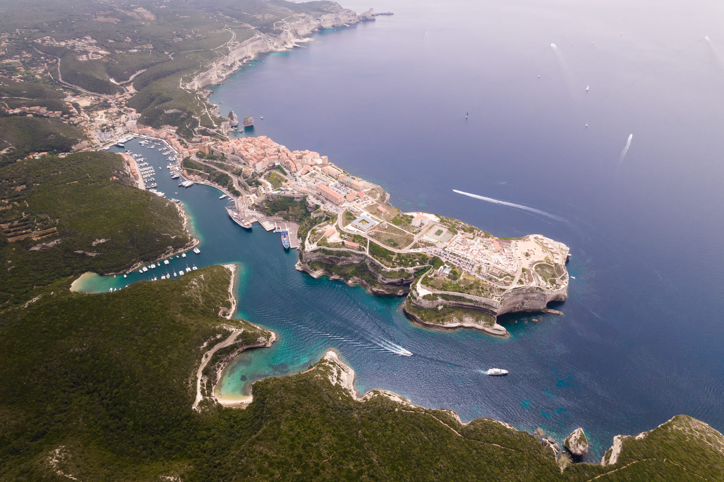 Aerial view of a coastal town with turquoise water